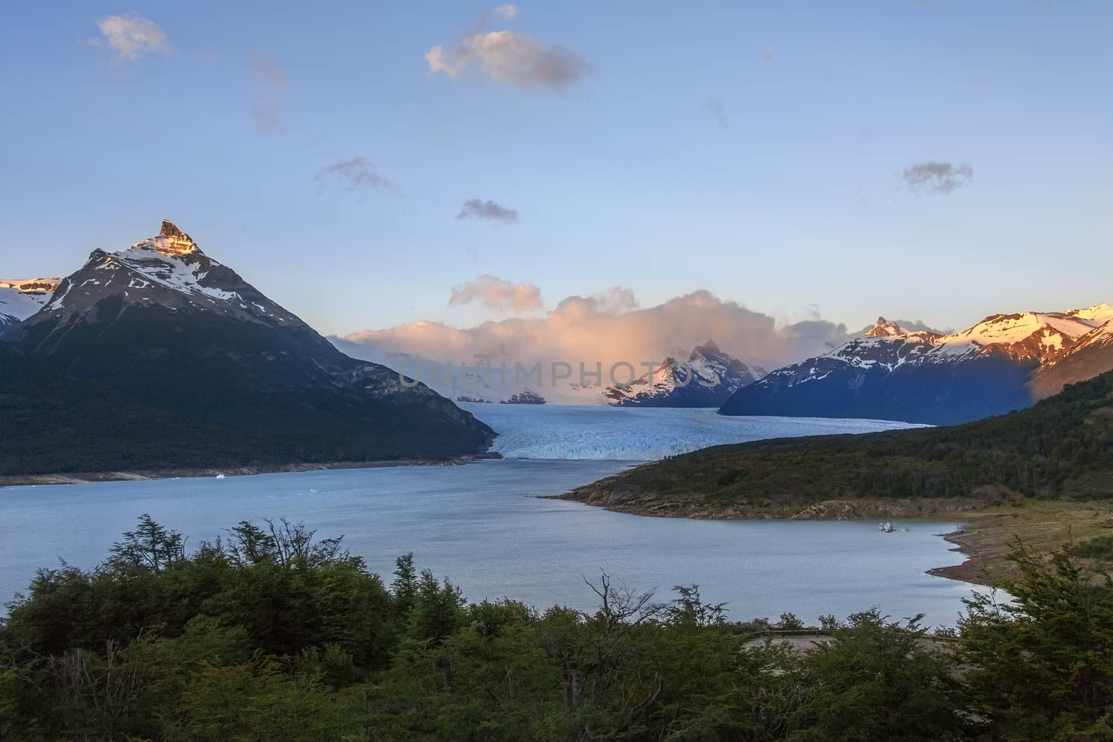 First rays of dawn sunlight on the peaks around the Perito Moreno Glacier is a glacier located in the Los Glaciares National Park in Patagonia in the southwest of Santa Cruz province in Argentina. 