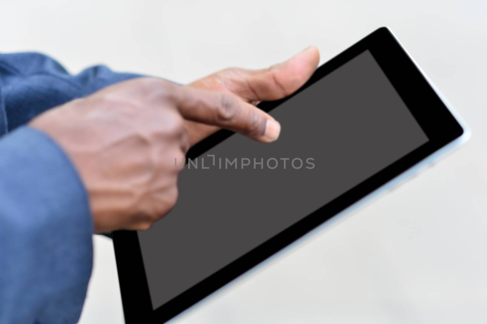 Close up of male hand working in digital tablet