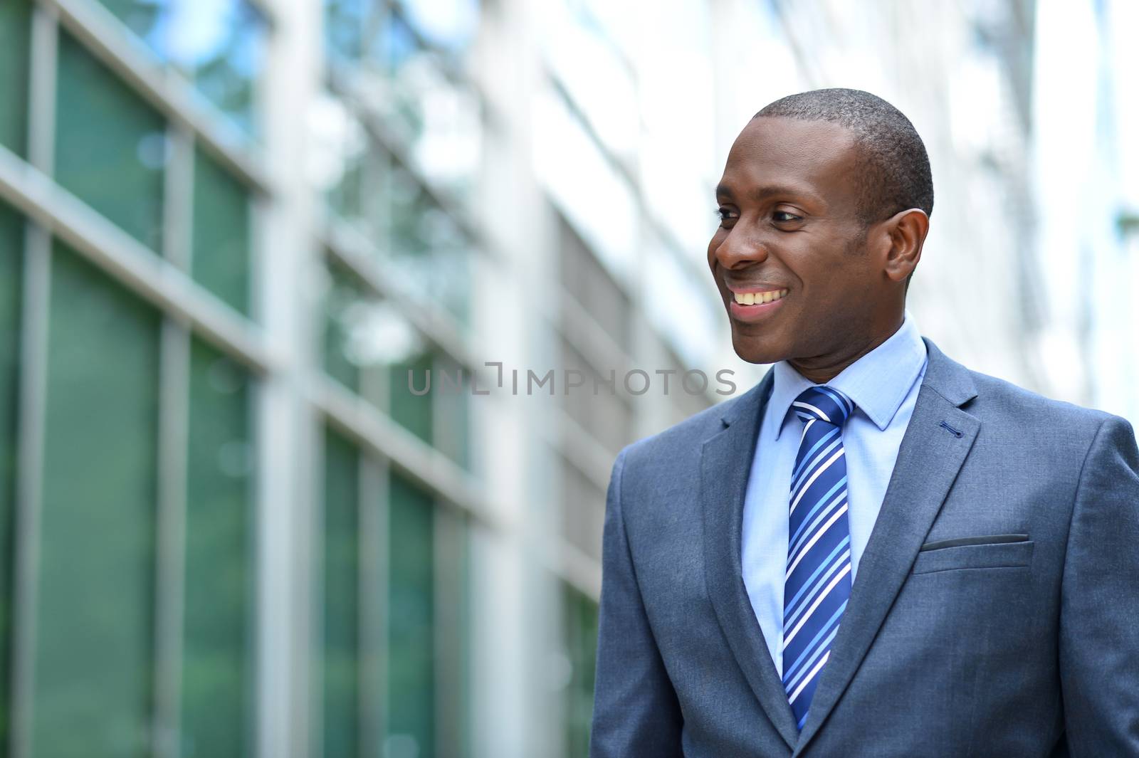 Smiling middle aged businessman at outdoors