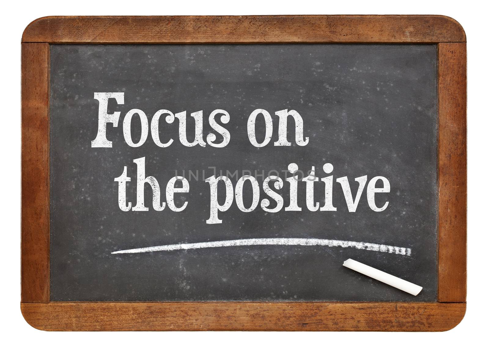 Focus on the positive - inspirational advice n on a vintage slate blackboard