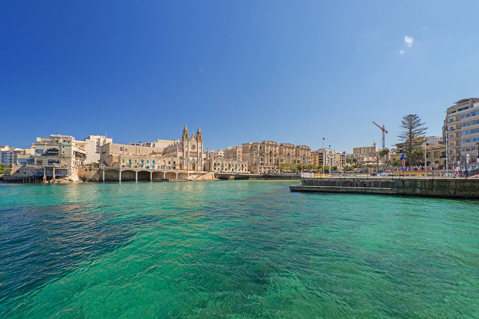 Neo-gothic Carmelite Parish Church and Balluta Buildings in Balluta Bay, St Julian's, Malta