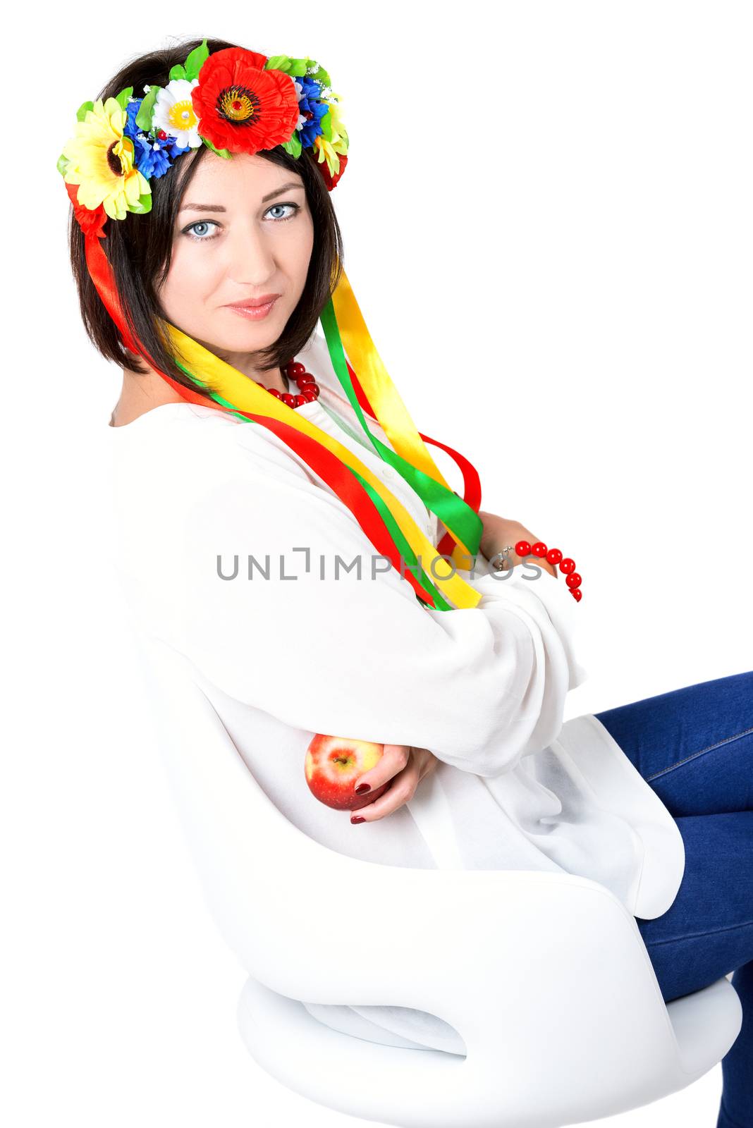 beautiful young brunette woman wearing national ukrainian clothes posing in studio on white background