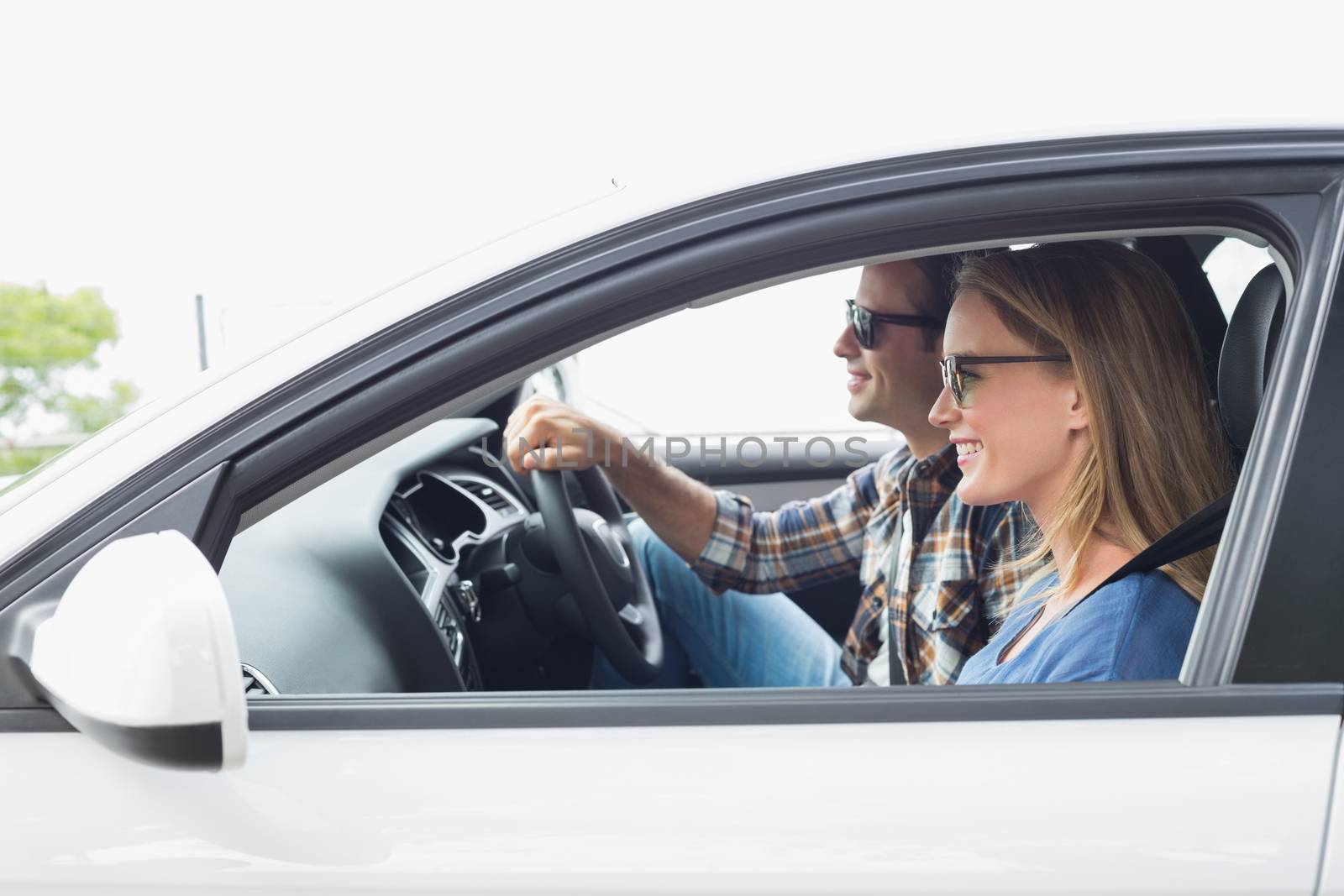 Couple on a road trip in their car