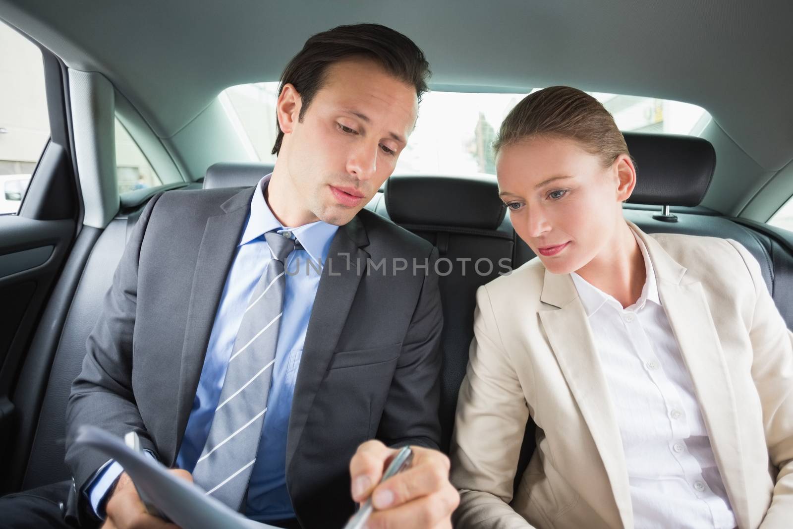 Business team working together in the car