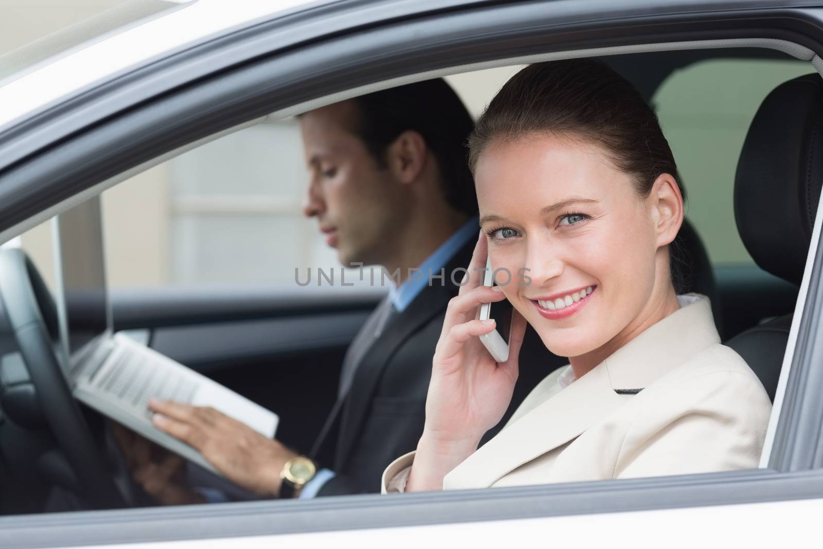 Business team working together in the car