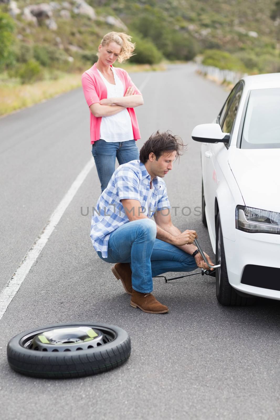 Couple after a car breakdown at the side of the road