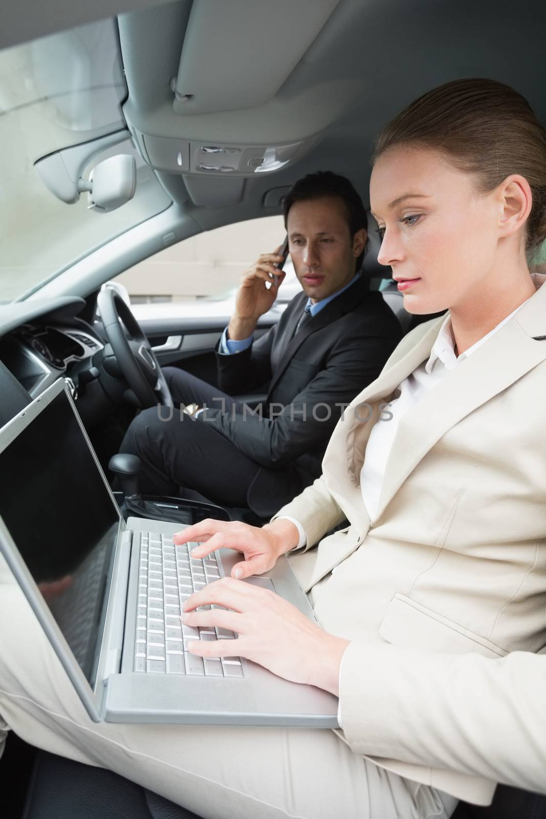 Business team working together in the car