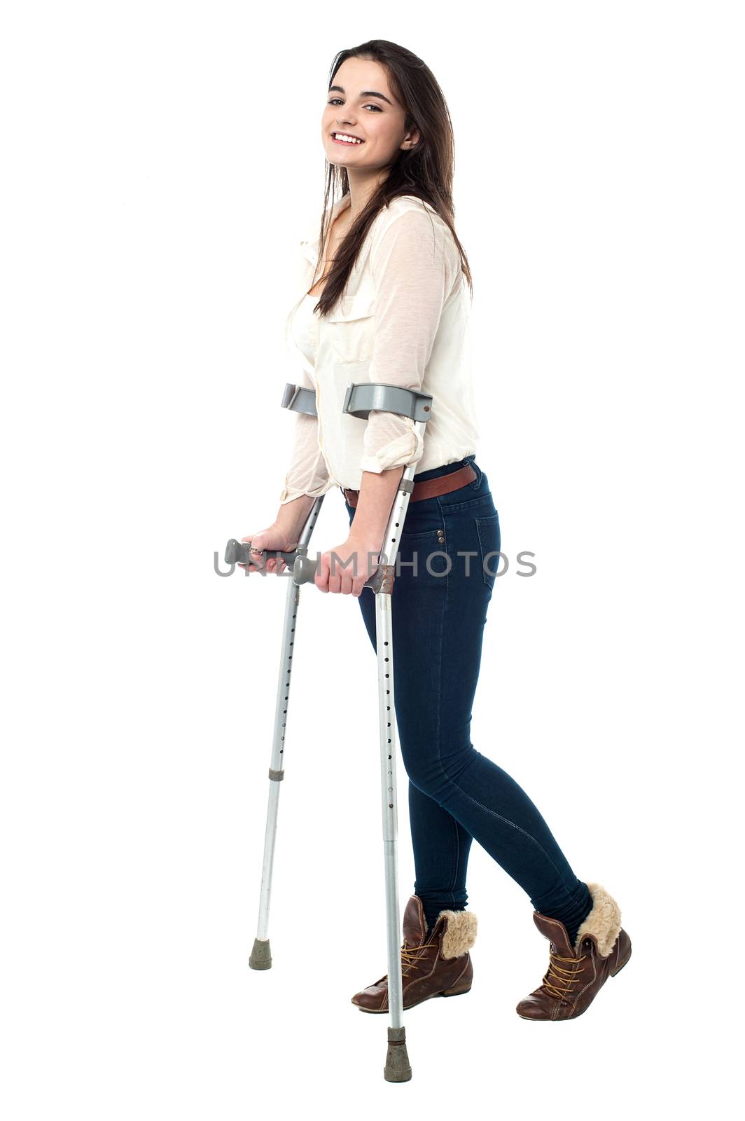 Trendy young girl walking with crutches