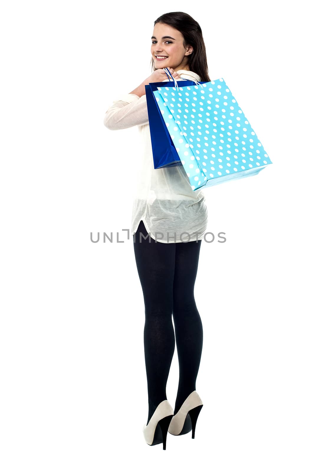 Full length shot of young girl with shopping bags