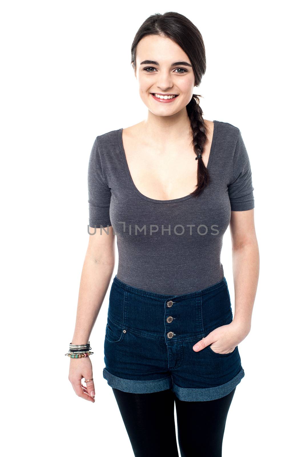 young girl in stylish fashion attire with hand in pocket