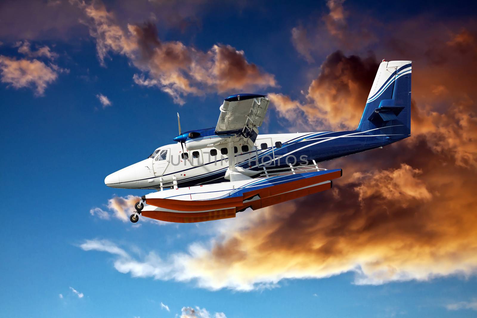 seaplane landing against some stormy clouds 