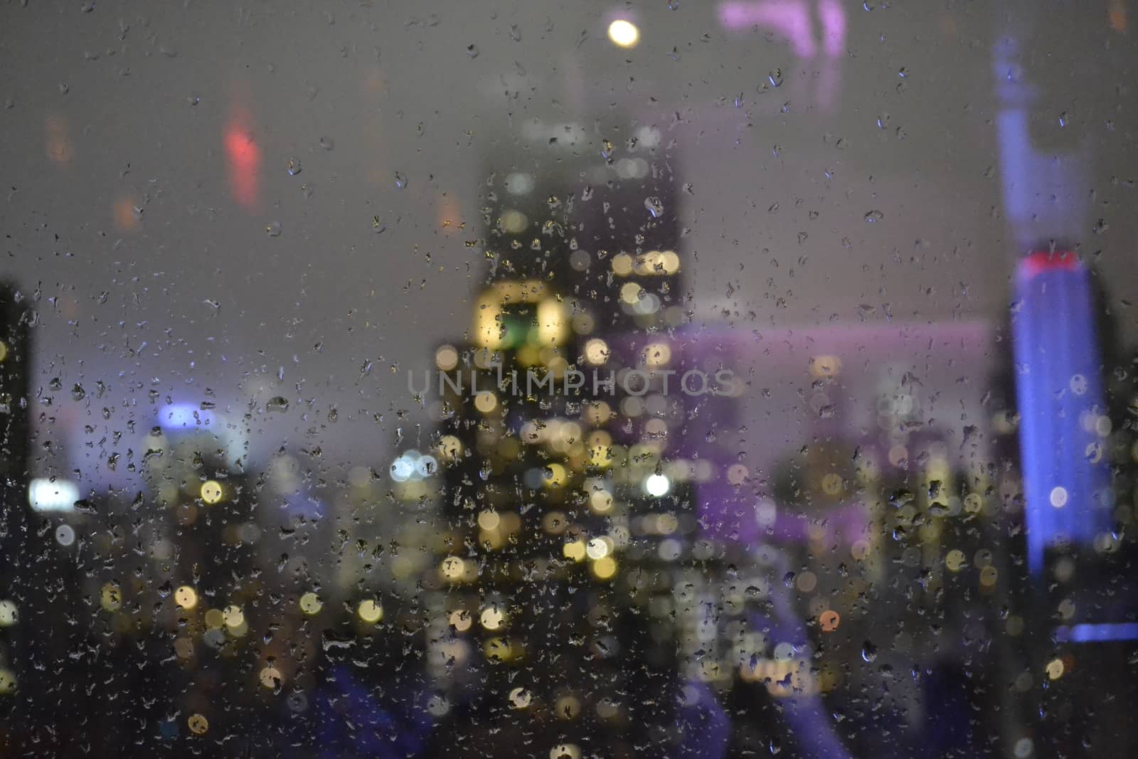Empire State in the background on a photography focused on a wet glass after a storm