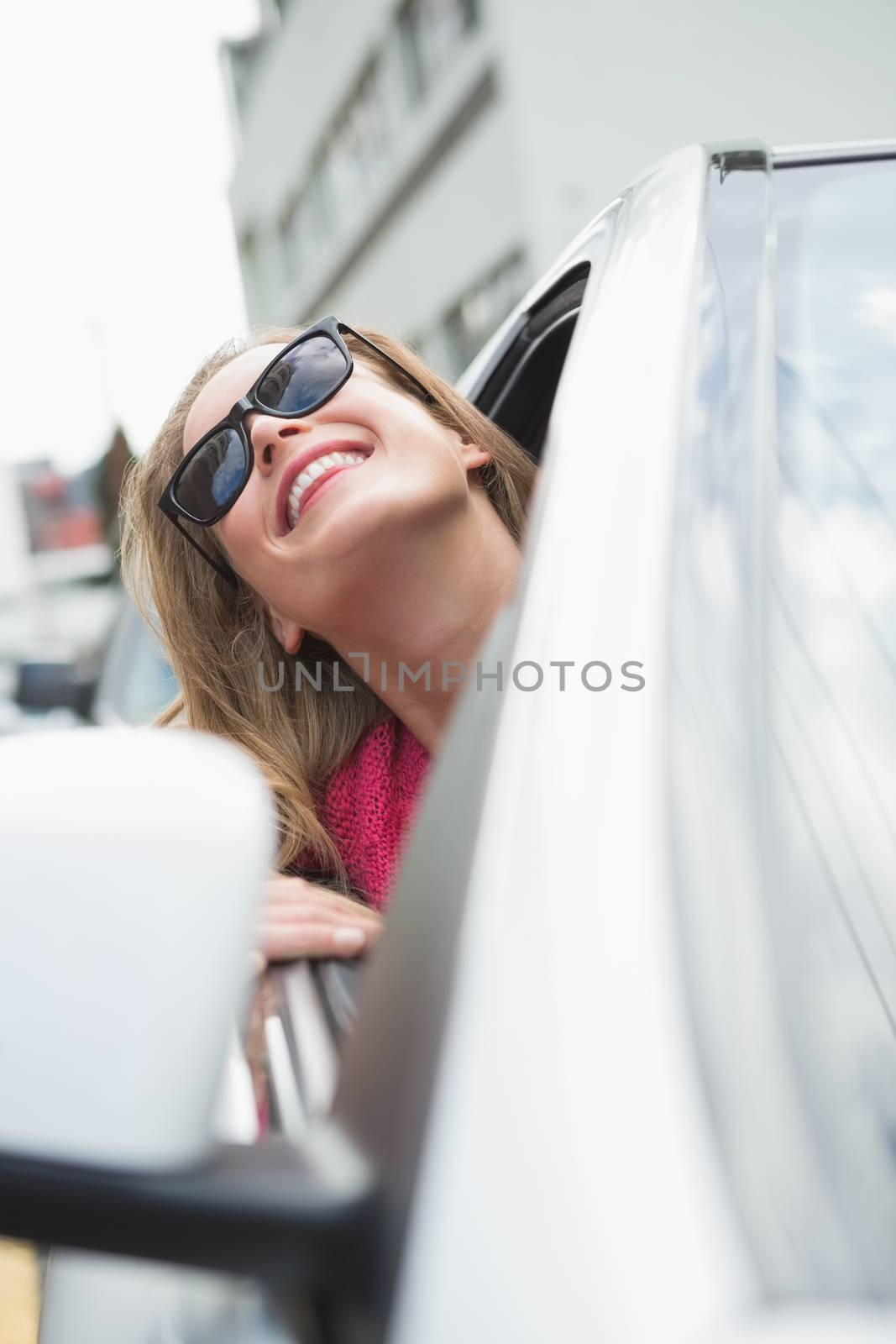 Happy woman in the drivers seat  by Wavebreakmedia