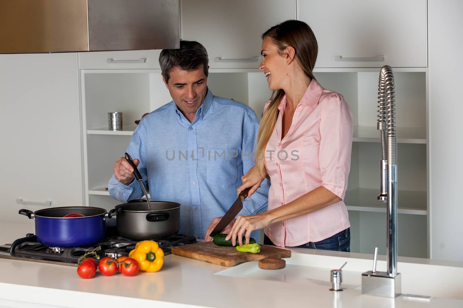 couple cooking in the  kitchen