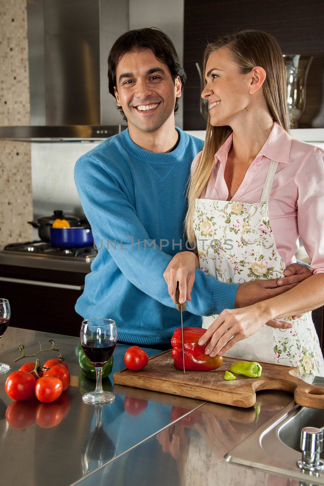 couple cutting vegetables