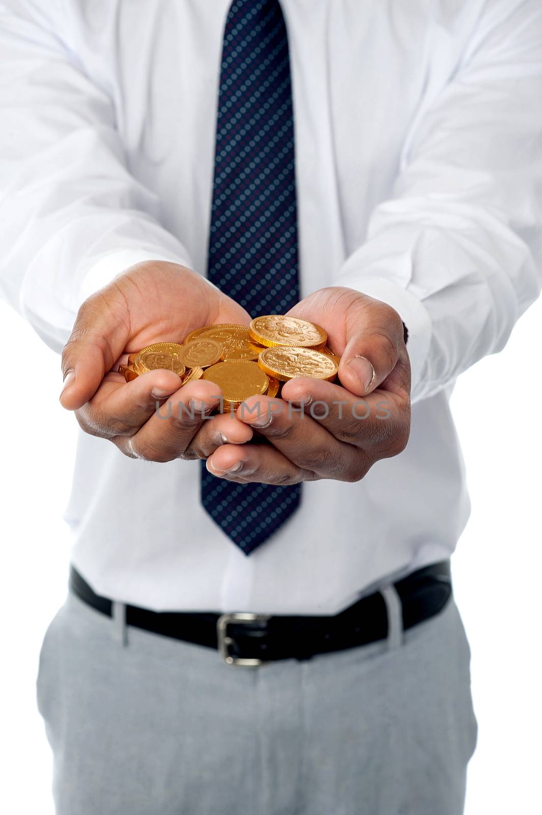 Closeup of businessman holding gold coins