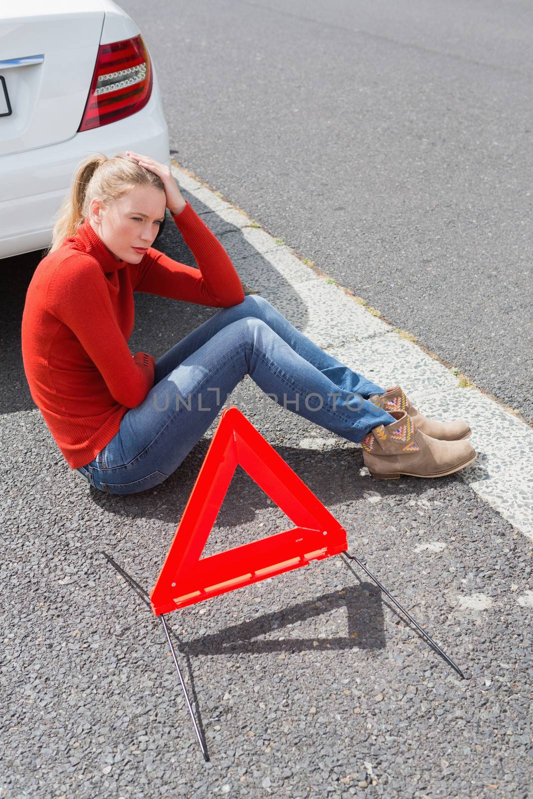 Triangle warning sign with broken down car 