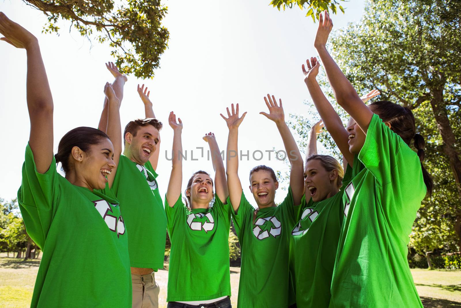 Environmental activists putting hands together on a sunny day