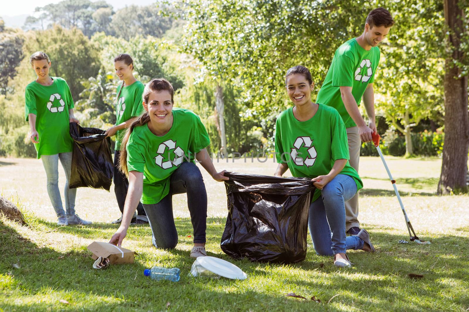 Environmental activists picking up trash on a sunny day