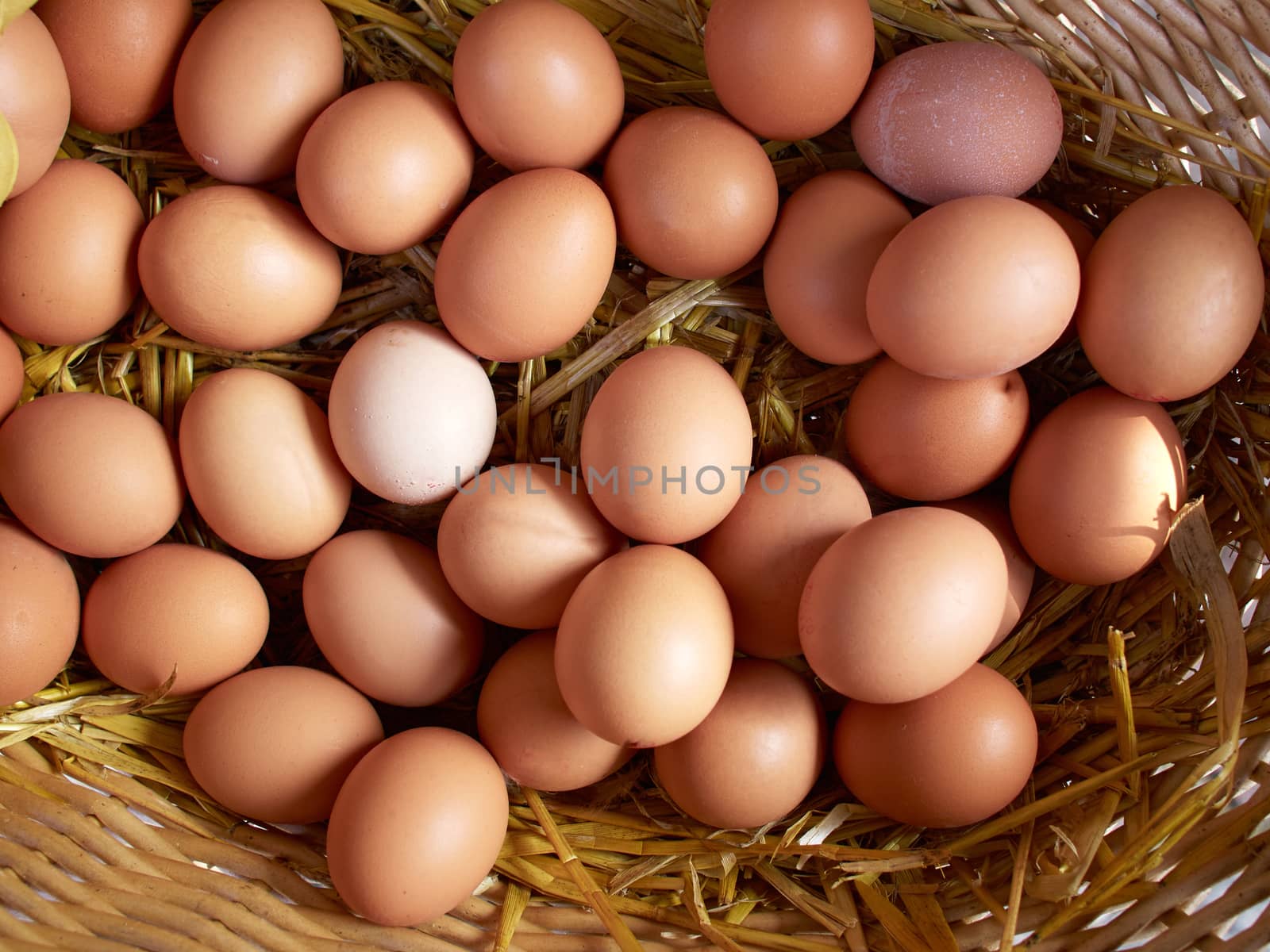 Fresh organic brown eggs basket in a market
