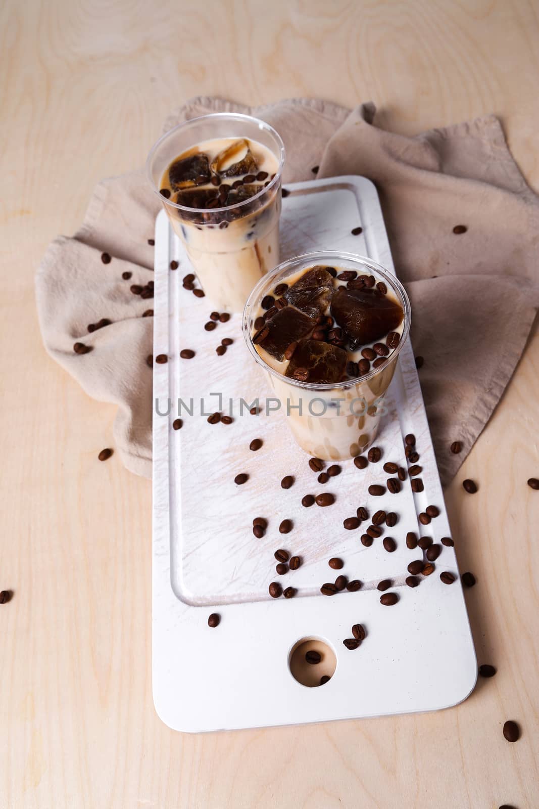 Delicious coffee with ice cubes