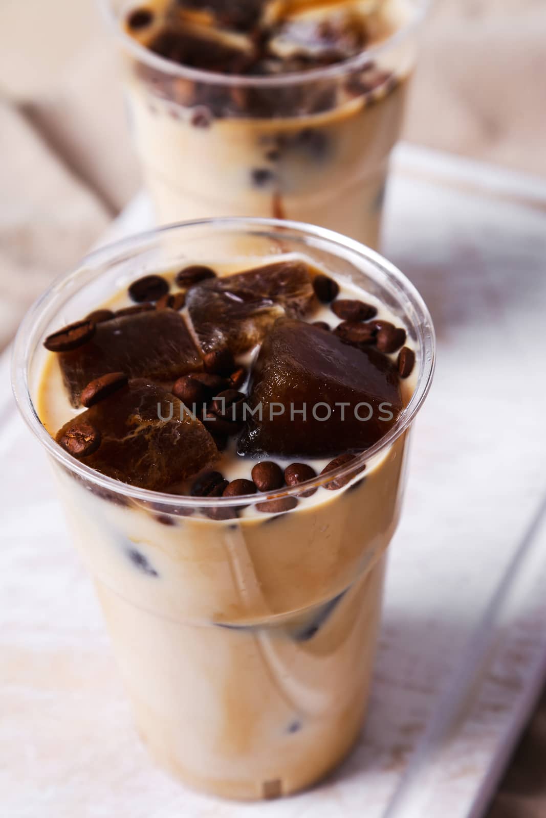 Delicious coffee with ice cubes