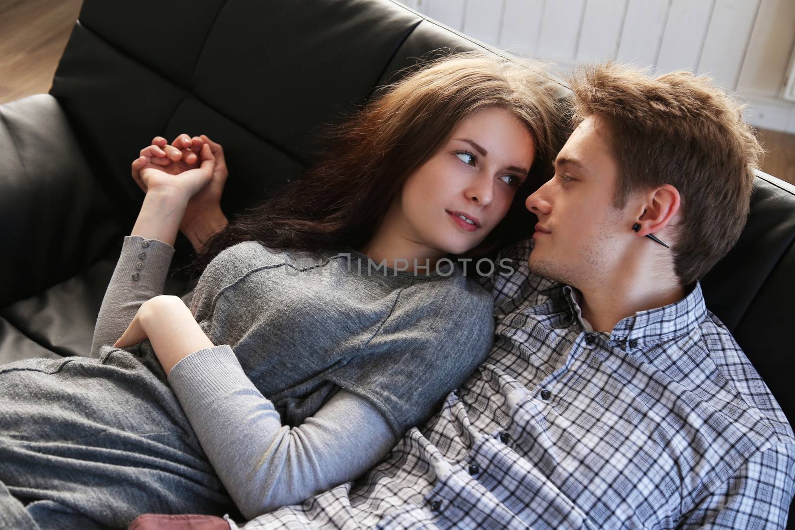 Love, relationship. Beautiful couple at home