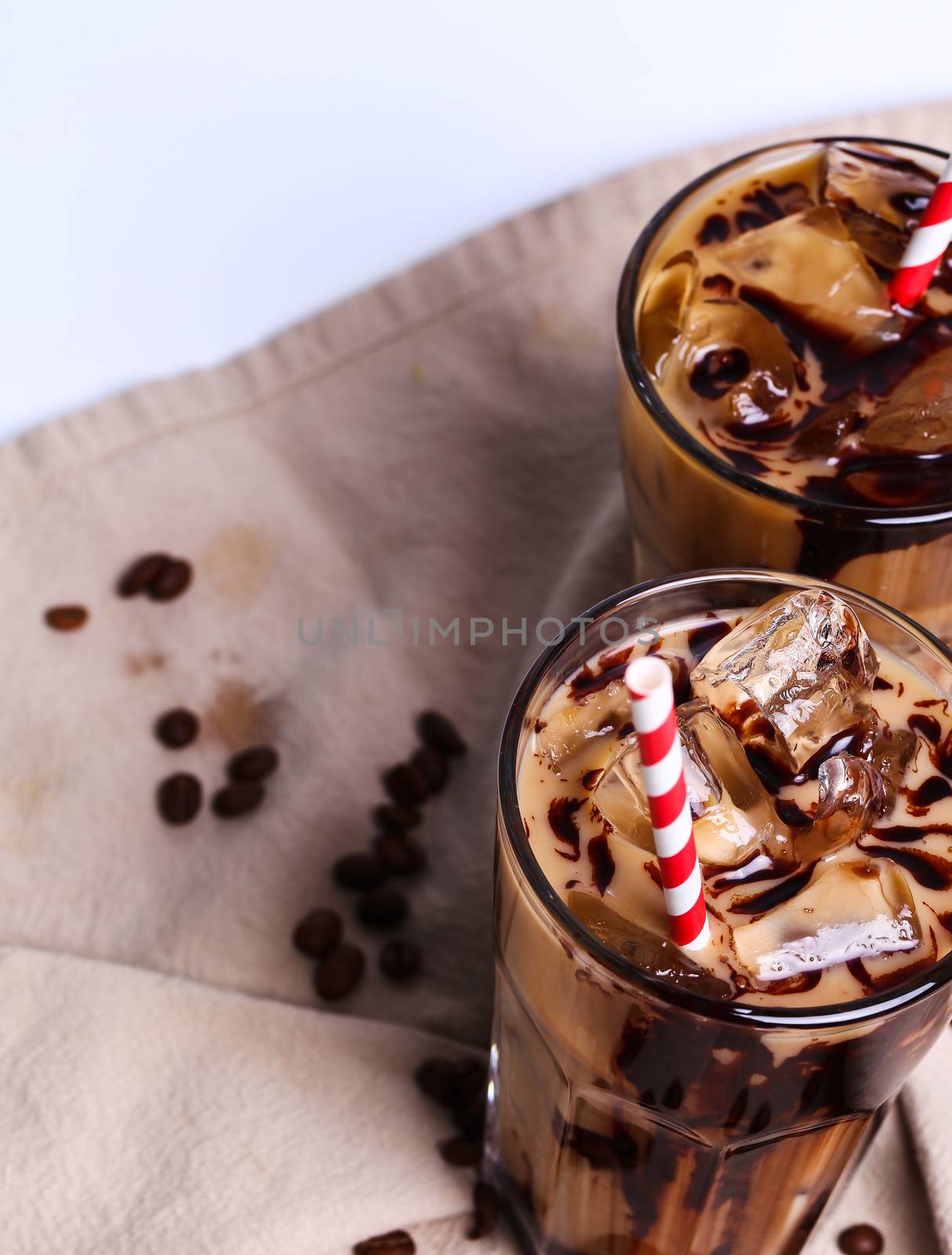 Delicious coffee with ice cubes