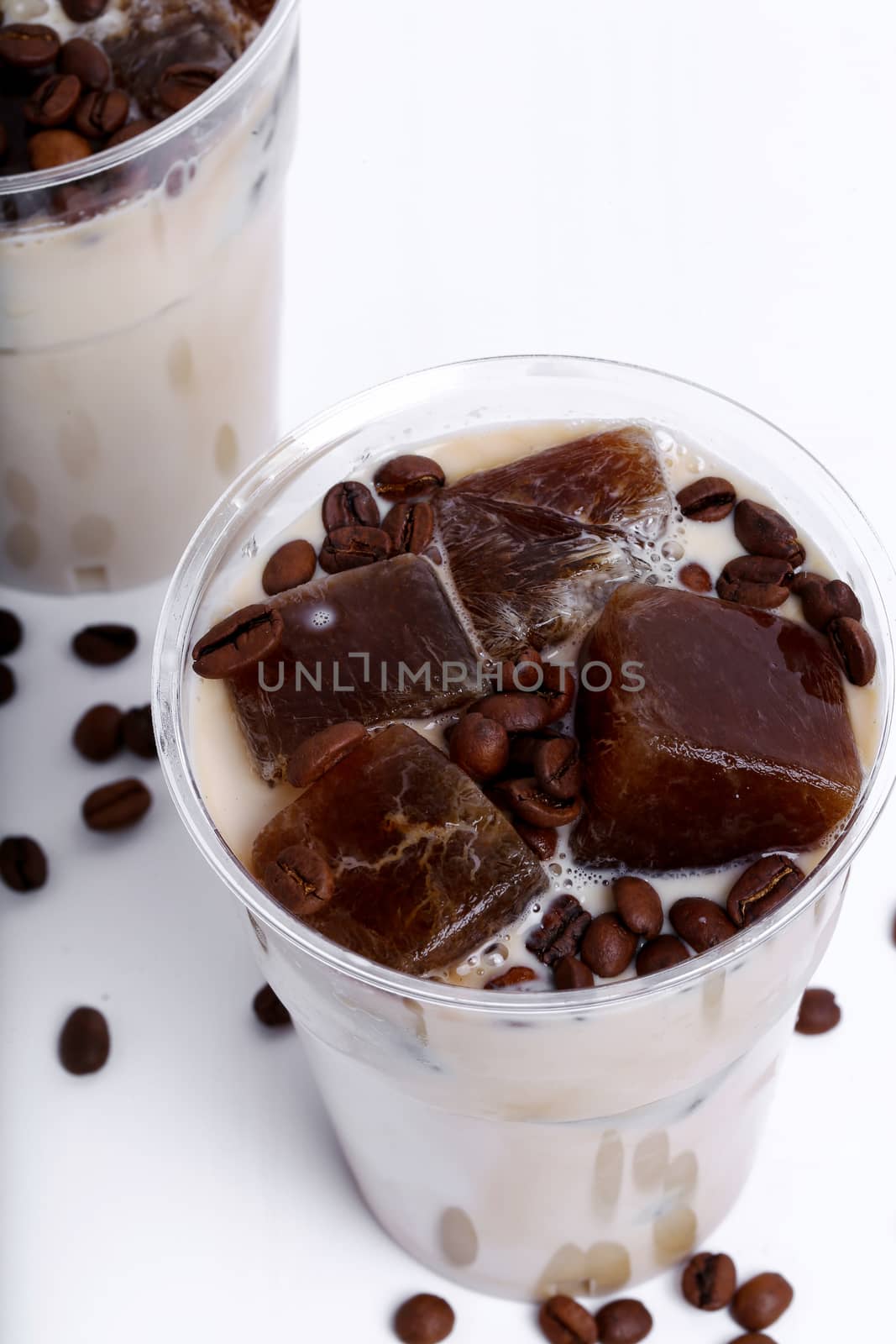 Delicious coffee with ice cubes