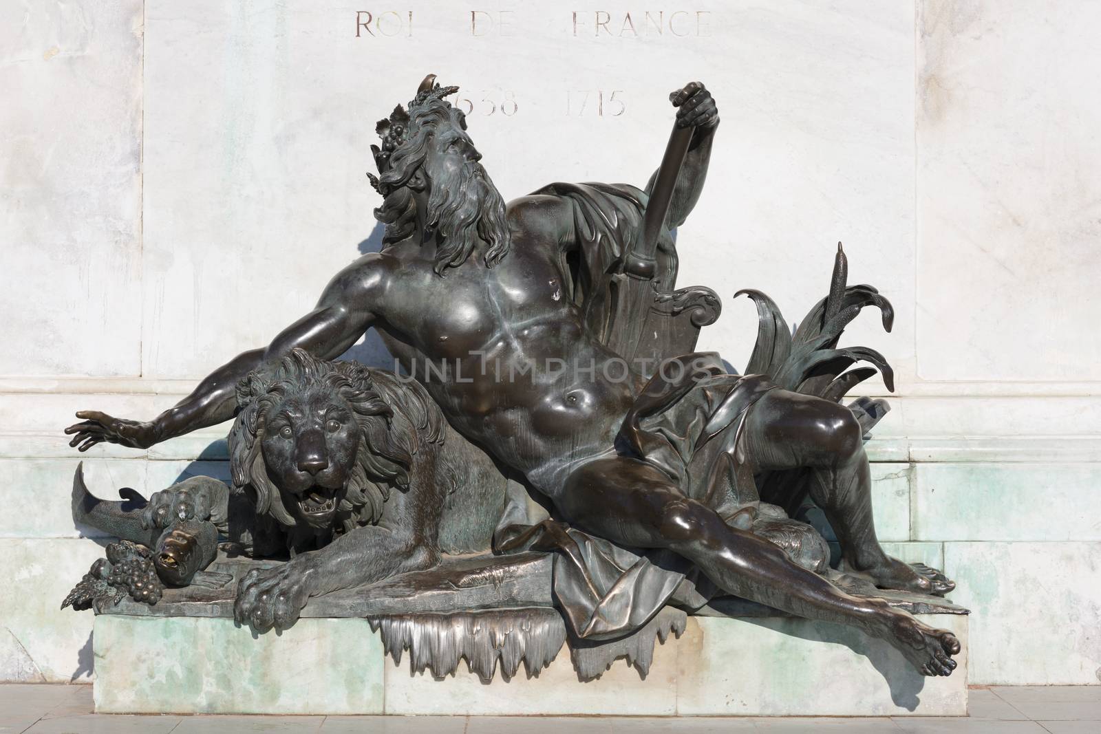 Allegorical statue of the Rhone river, under the statue of Louis XIV. Bellecour square, Lyon, France