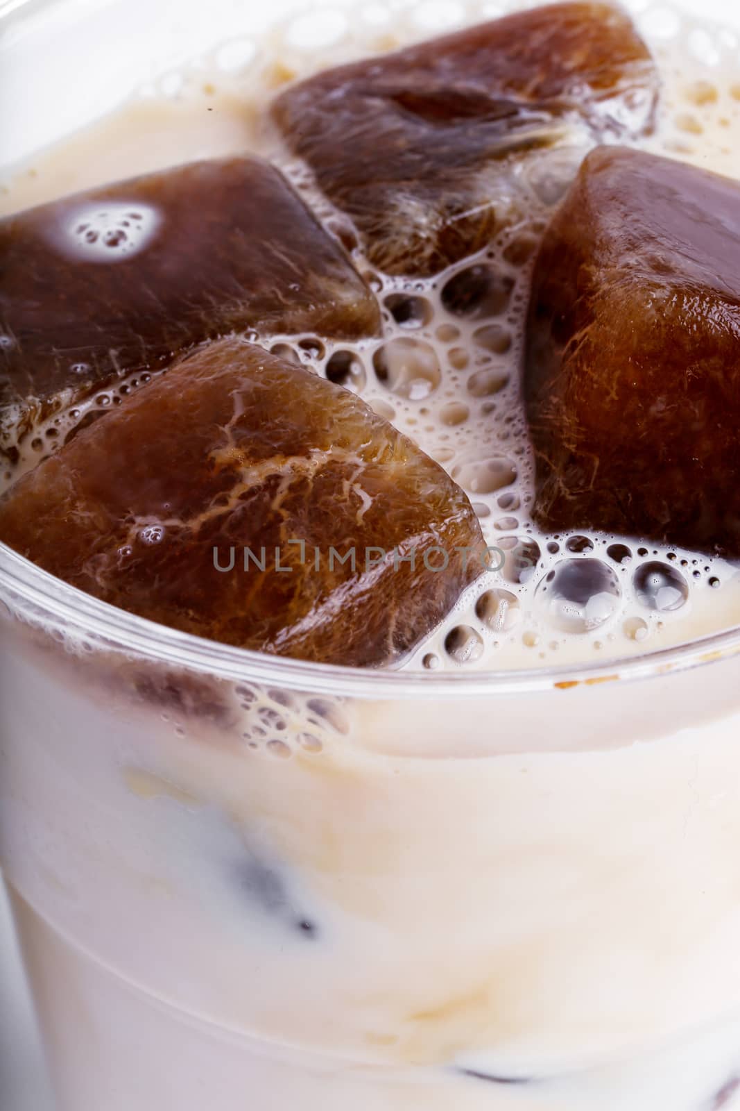 Delicious coffee with ice cubes