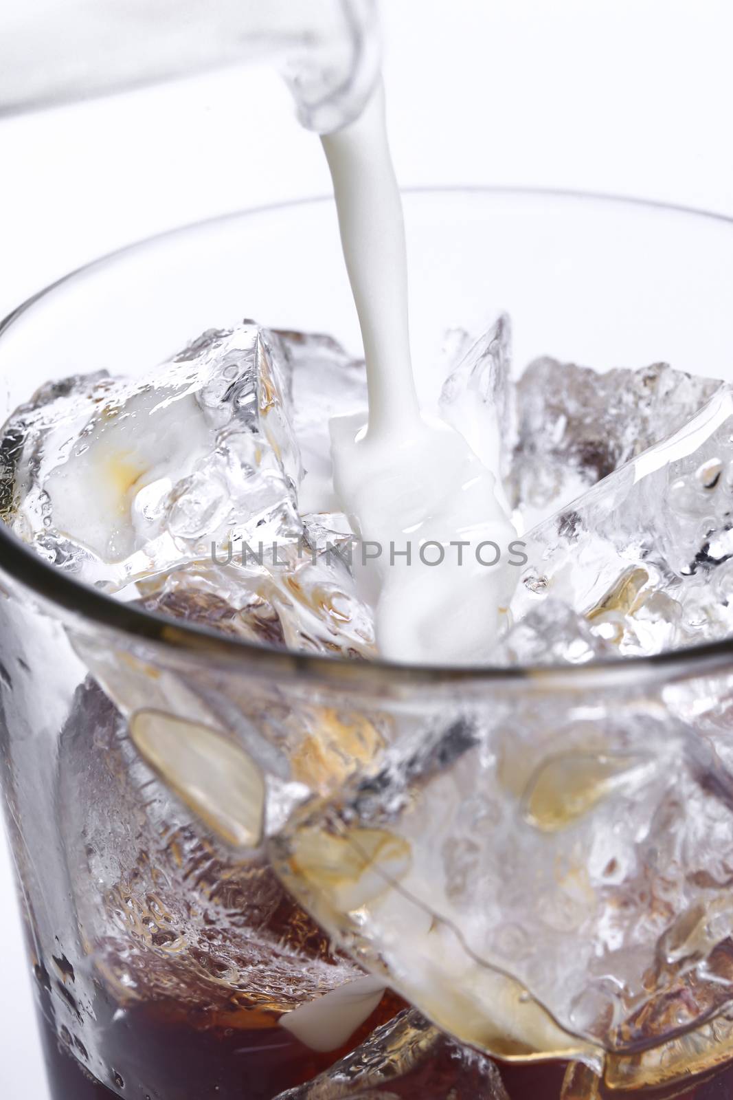 Glass of cold coffee on a white background