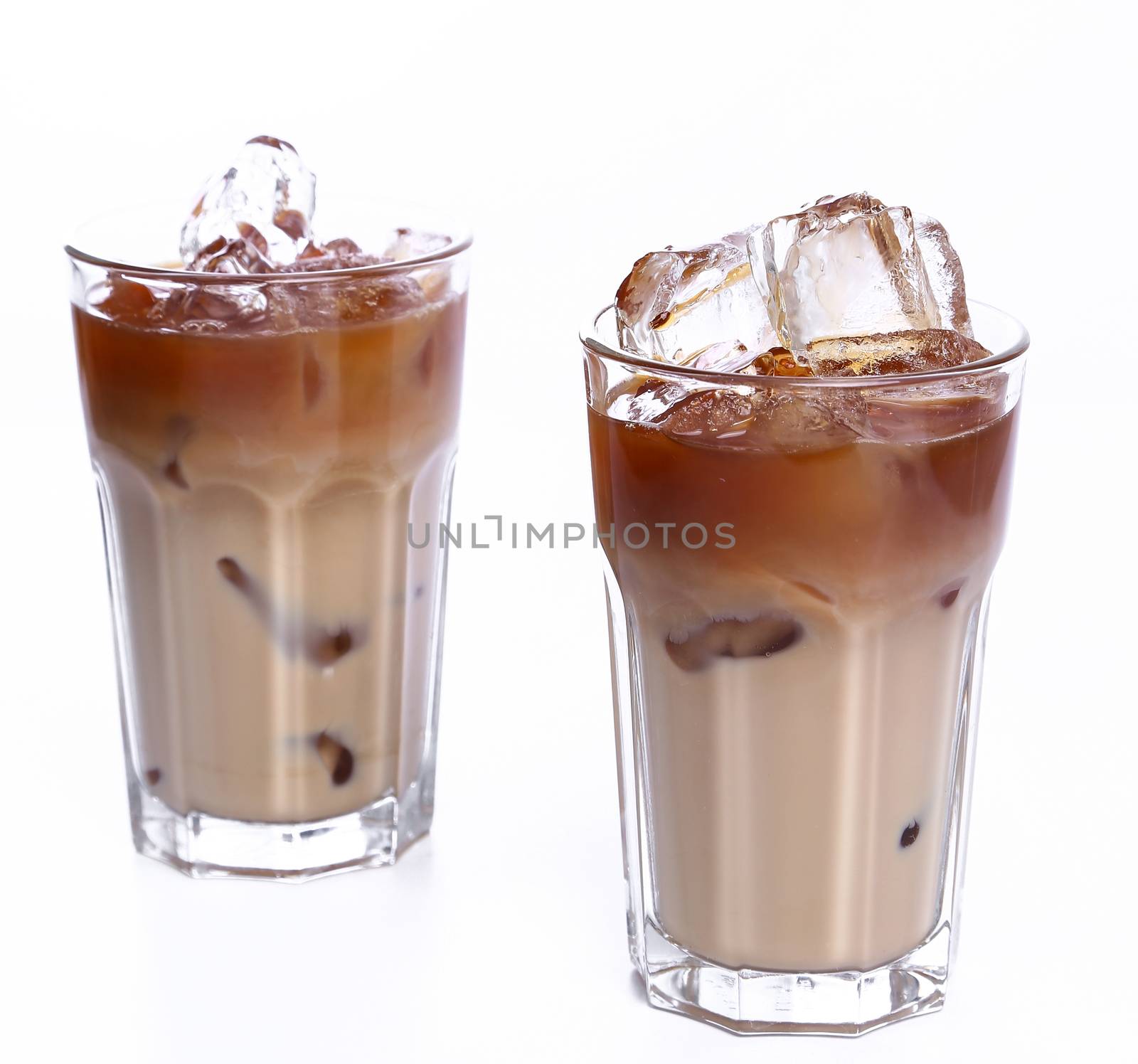 Glass of cold coffee on a white background