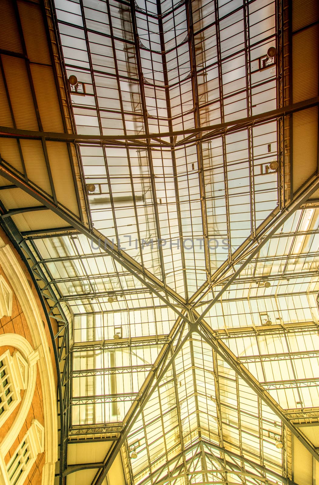 LONDON - SEPTEMBER 27, 2013: Liverpool Street station roof glass. Since 1874,third busiest railway terminus after Waterloo, Victoria, serves 25 million passengers per year.