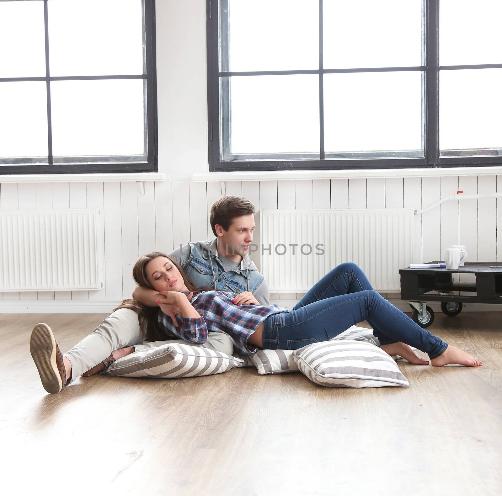 Love, relationship. Beautiful couple on the floor