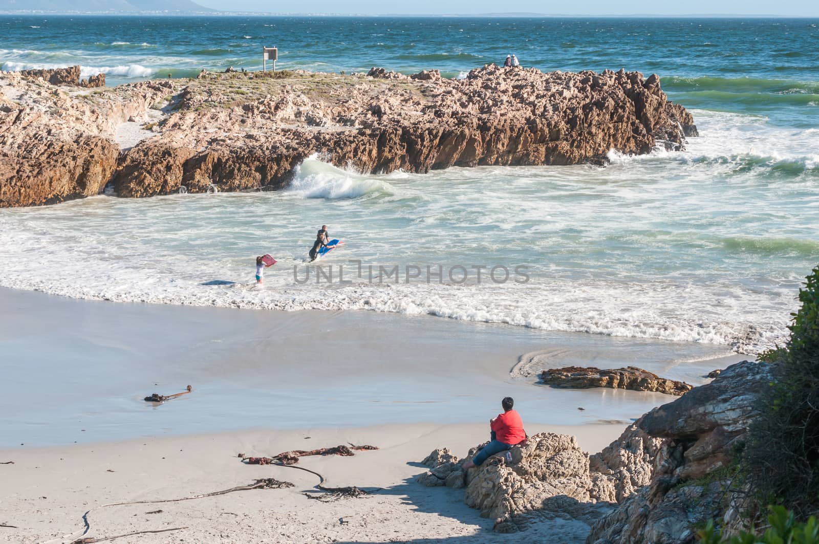 HERMANUS, SOUTH AFRICA - DECEMBER 10, 2014:  Unidentified people at a secluded beach in Hermanus