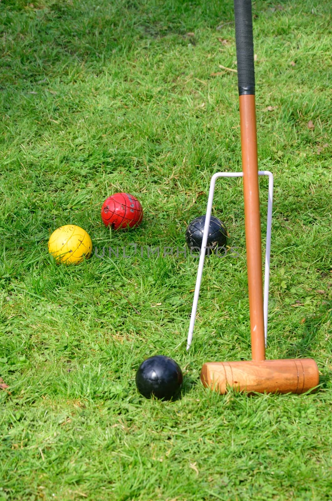 Croquet mallet with balls