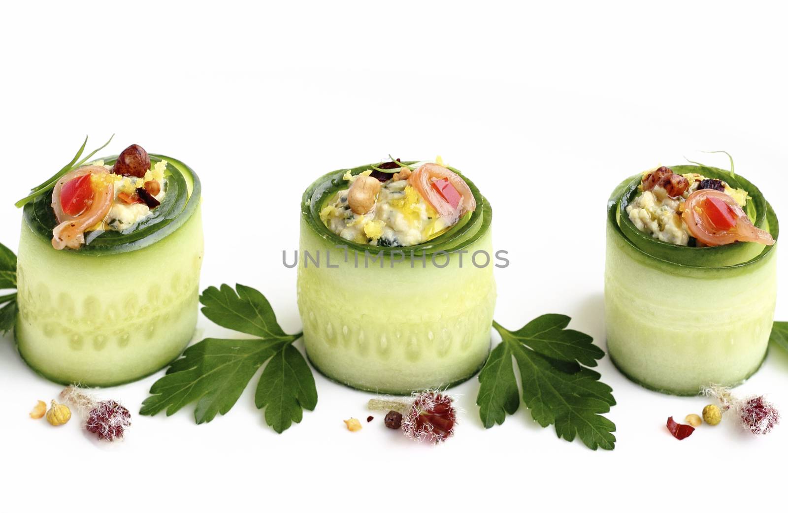 Close up cucumber rolls filled with savory cream cheese