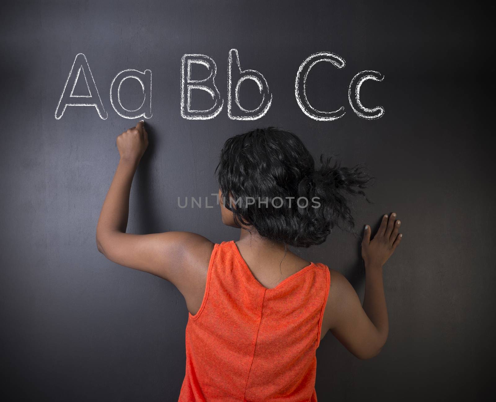 South African or African American woman teacher or student learn alphabet write writing by alistaircotton