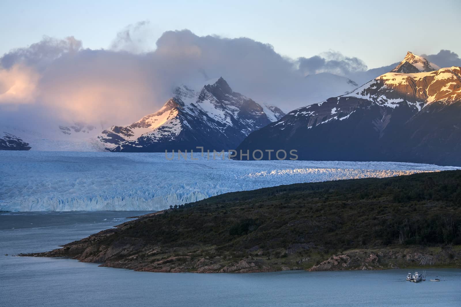 First rays of dawn sunlight on the peaks around the Perito Moreno Glacier. A glacier located in the Los Glaciares National Park in Patagonia in the southwest of Santa Cruz province in Argentina. 