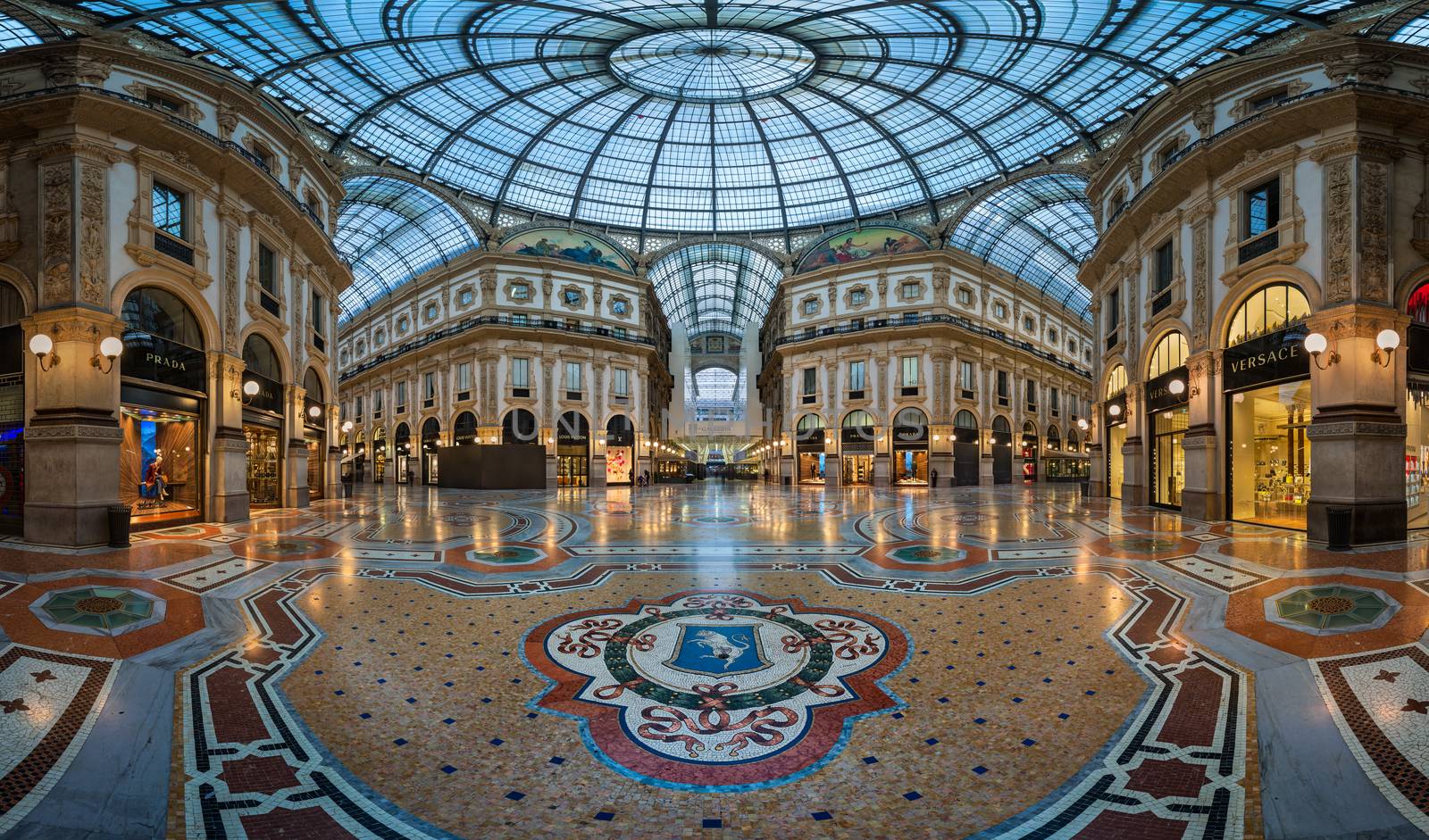 MILAN, ITALY - JANUARY 13, 2015:  Famous Bull Mosaic in Galleria Vittorio Emanuele II in Milan. It's one of the world's oldest shopping malls, designed and built by Giuseppe Mengoni between 1865 and 1877.