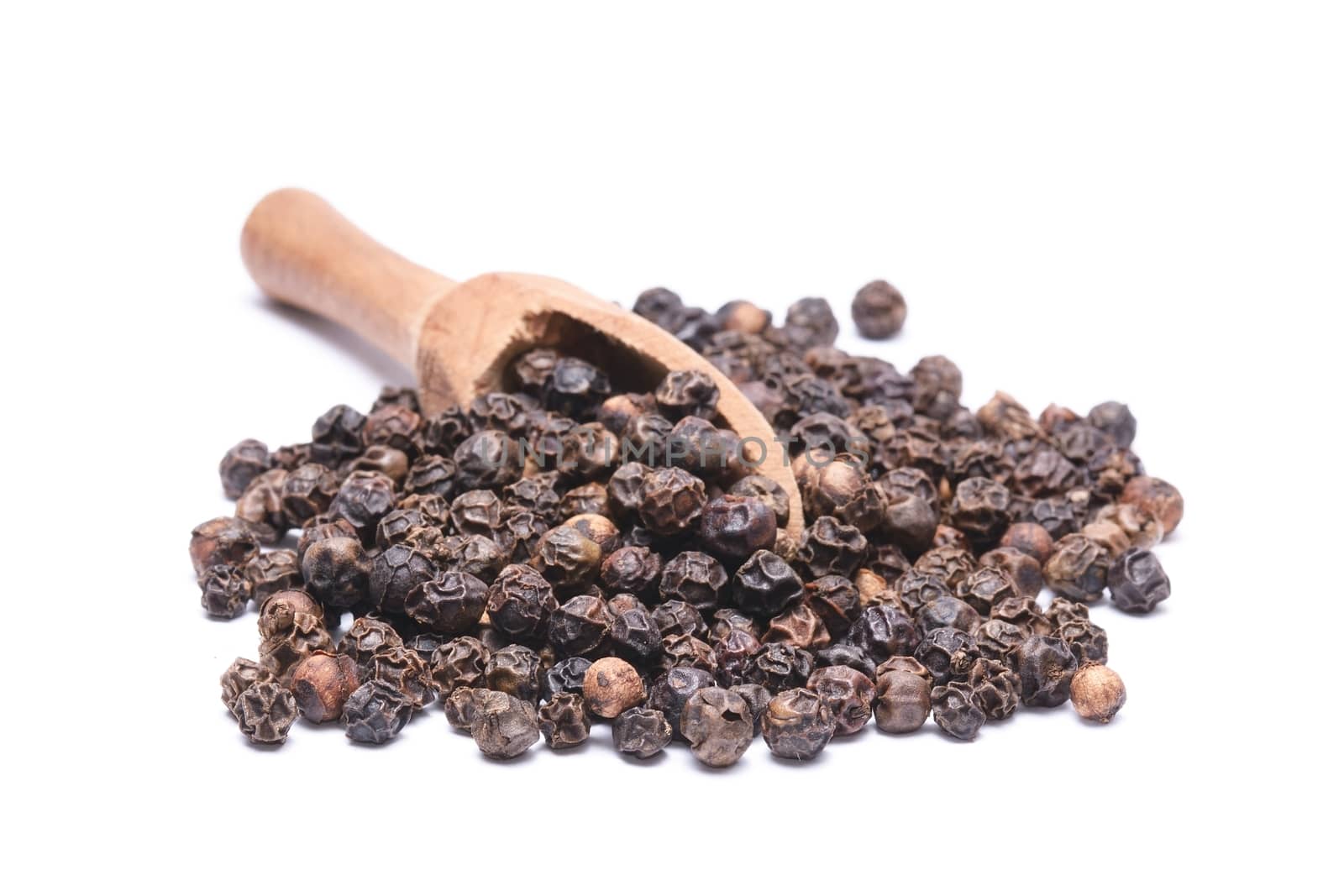 Black peppercorns isolated on white background by comet