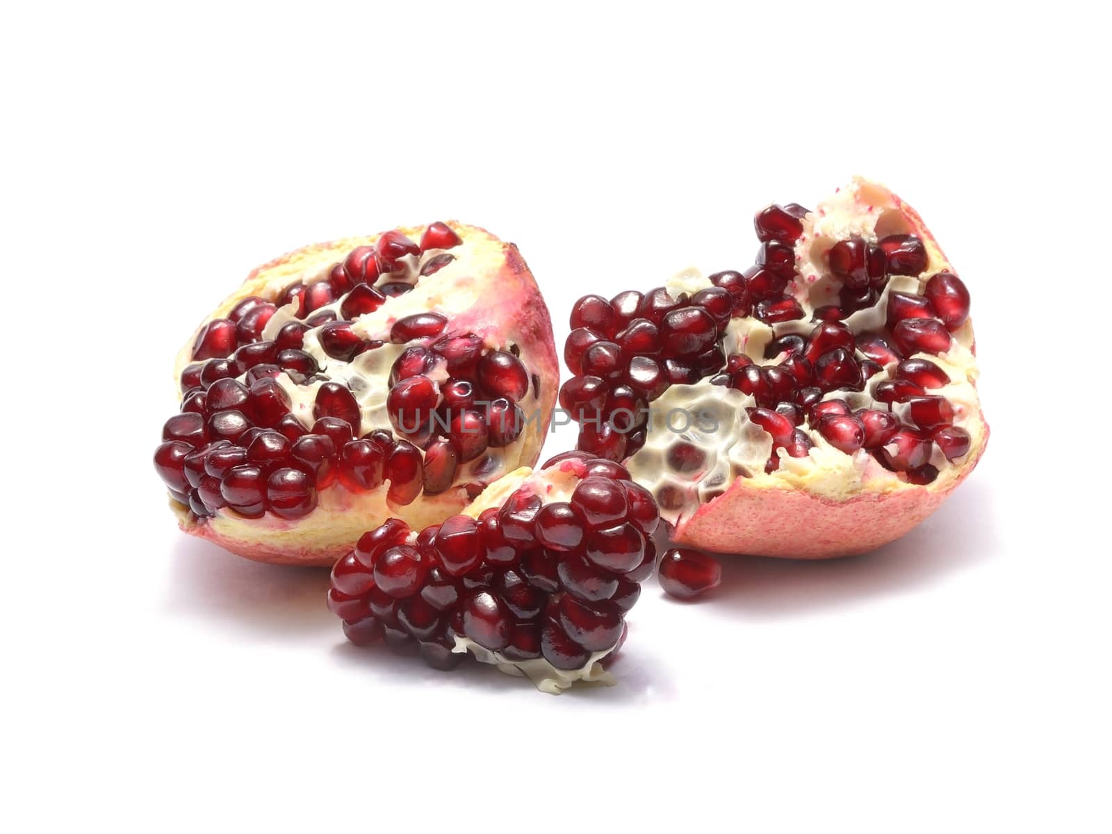 Fresh pomegranate isolated on white background by comet