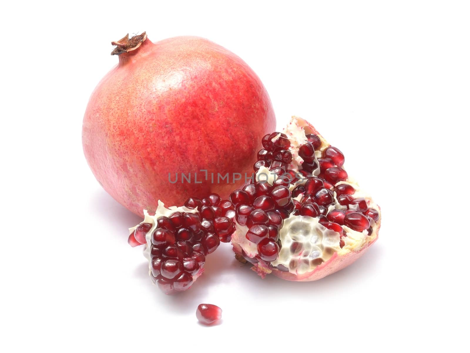 Fresh pomegranate isolated on white background