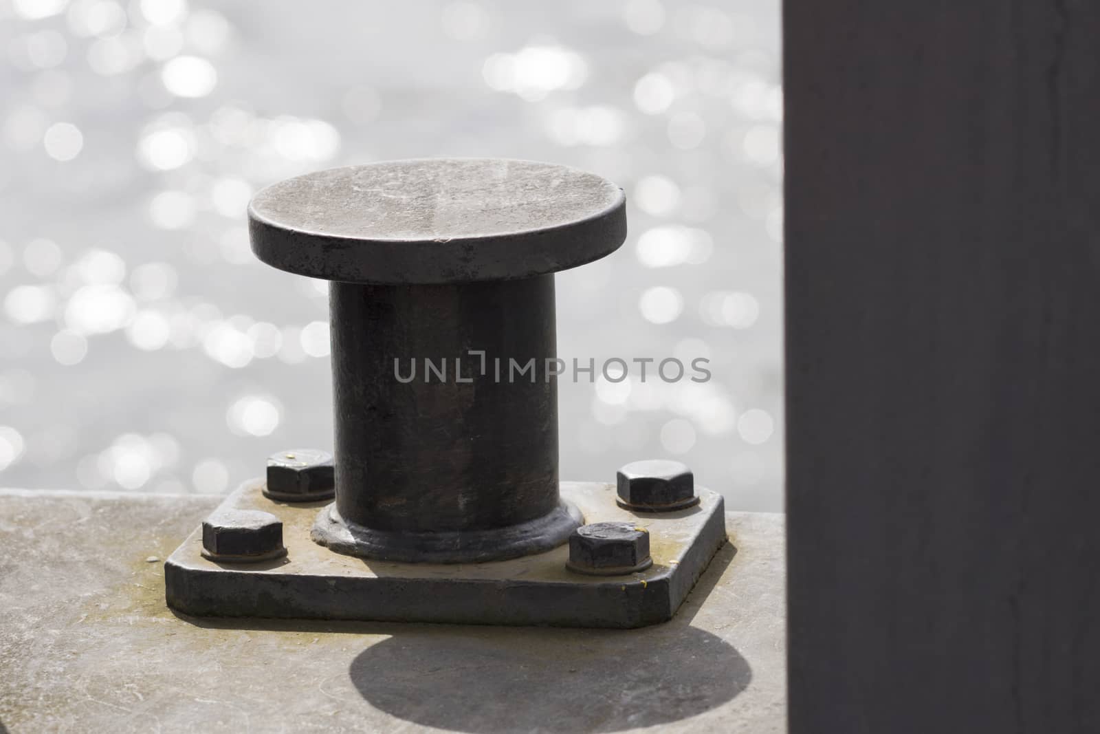 Bollard with water in background
