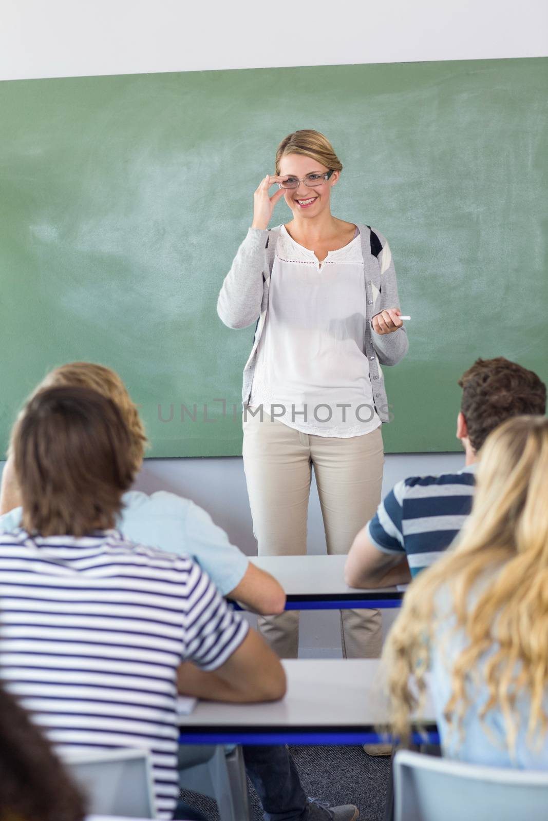 Teacher teaching students in class by Wavebreakmedia