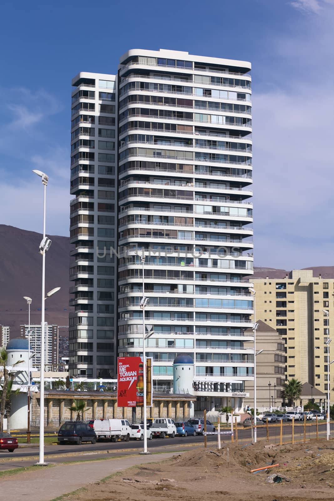IQUIQUE, CHILE - JANUARY 23, 2015: The entrance area of the modern residential building complex called Archipielago Mar Egeo along the Arturo Prat Chacon avenue on the Pacific coast on January 23, 2015 in Iquique, Chile