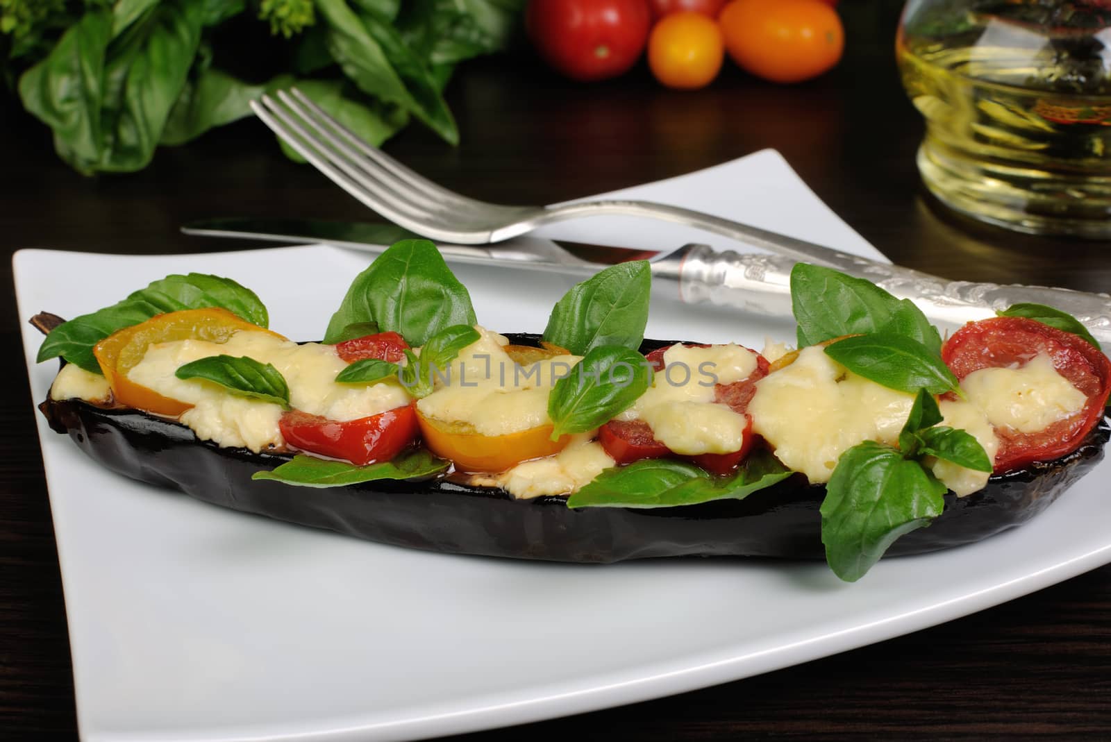 Baked eggplant with tomato cheese and basil