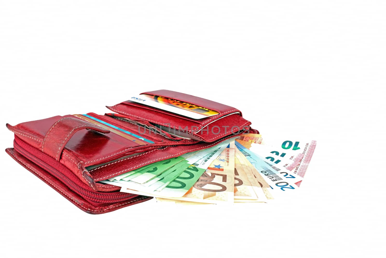 Red wallet full with euro banknotes on a white background.