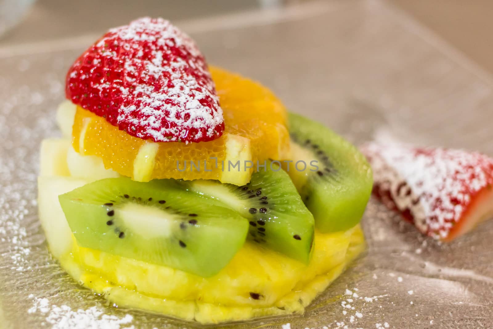 creation of fruit with strawberries, pineapple, kiwi and orange